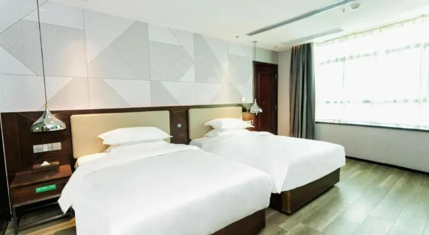 Bed in Borrman Hotel Yunfu Xinxing County Bus Station