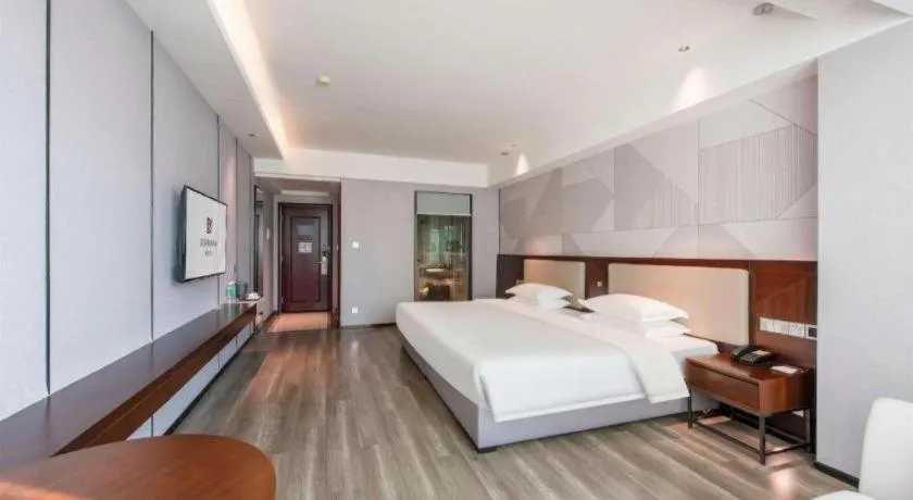 Bed in Borrman Hotel Yunfu Xinxing County Bus Station