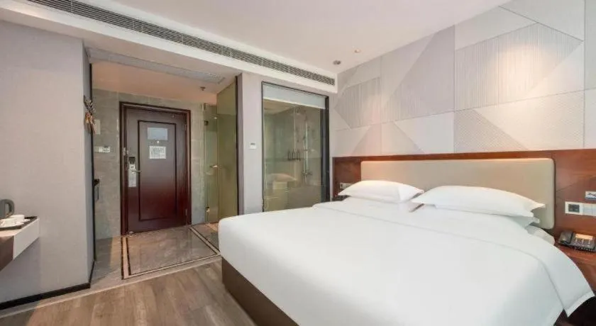 Bed in Borrman Hotel Yunfu Xinxing County Bus Station