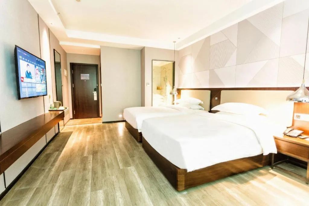 Bed in Borrman Hotel Yunfu Xinxing County Bus Station