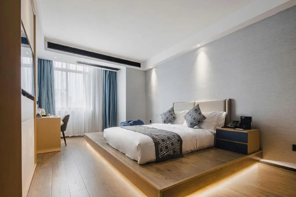 Bed in GEM Hotel Changzhou Xuejia'aoyuan North High-Speed Railway Station