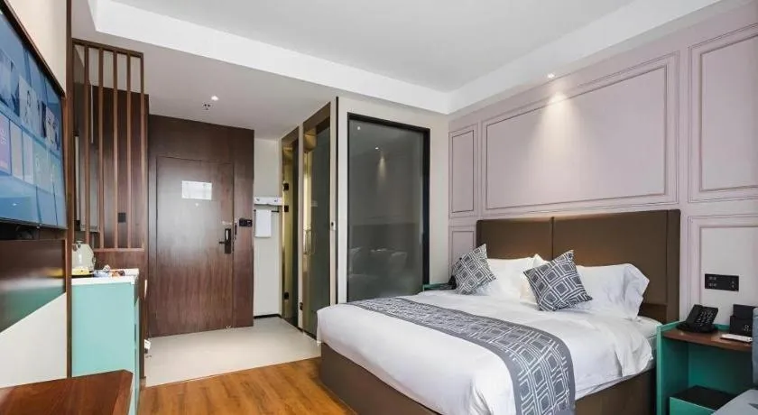 Bed in GEM Hotel Changzhou Xuejia'aoyuan North High-Speed Railway Station