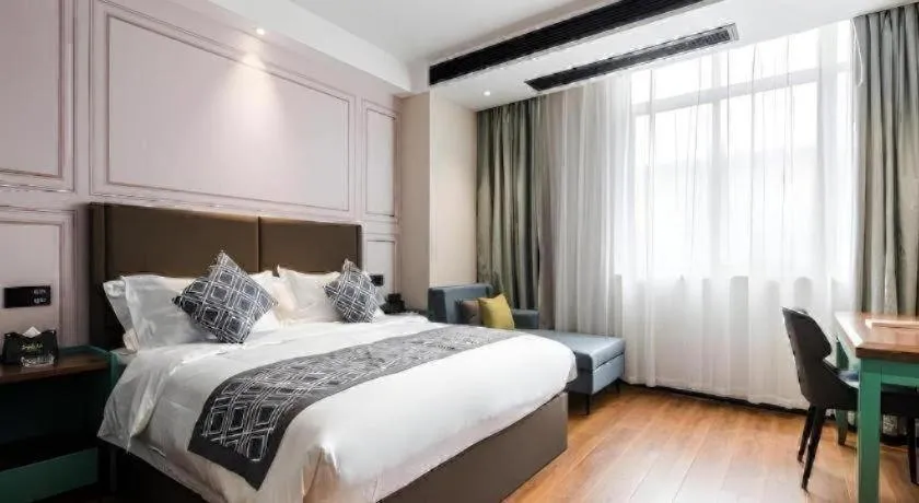 Bed in GEM Hotel Changzhou Xuejia'aoyuan North High-Speed Railway Station