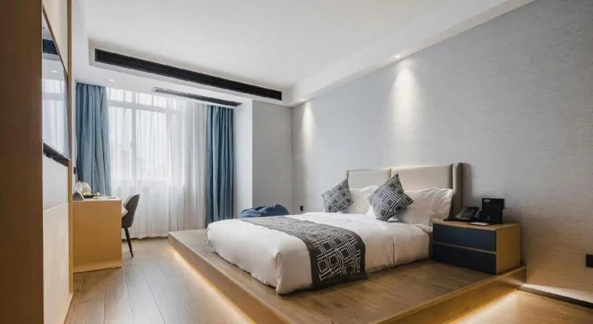 Bed in GEM Hotel Changzhou Xuejia'aoyuan North High-Speed Railway Station
