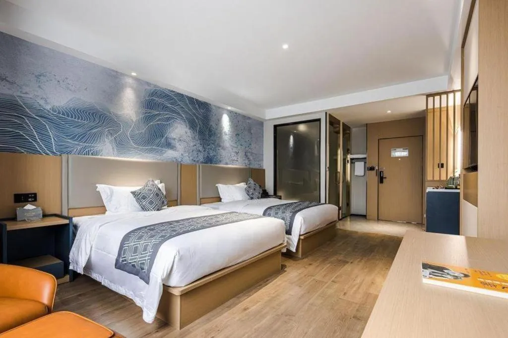 Bed in GEM Hotel Changzhou Xuejia'aoyuan North High-Speed Railway Station