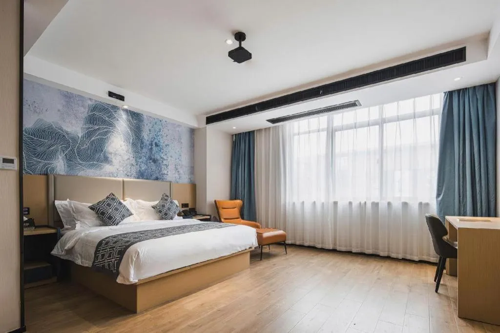 Bed in GEM Hotel Changzhou Xuejia'aoyuan North High-Speed Railway Station