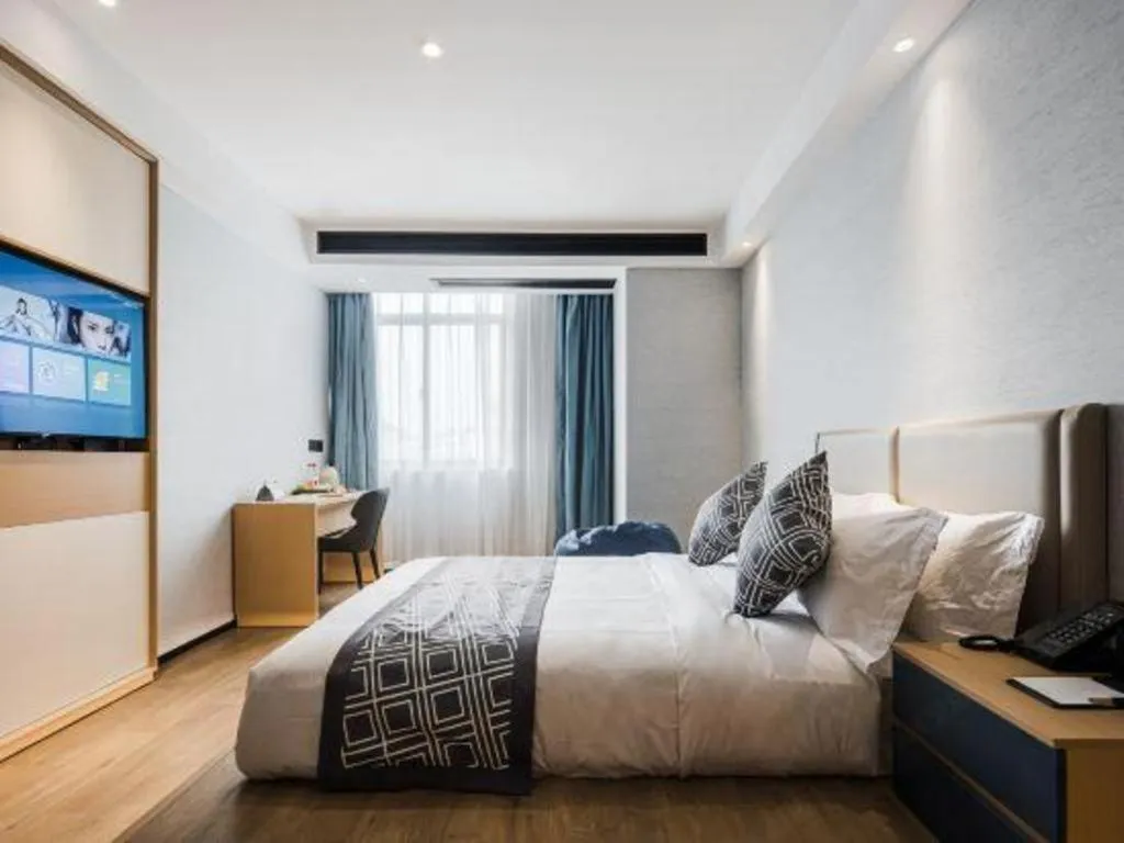 Bed in GEM Hotel Changzhou Xuejia'aoyuan North High-Speed Railway Station