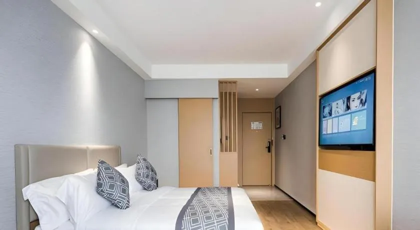 Bed in GEM Hotel Changzhou Xuejia'aoyuan North High-Speed Railway Station