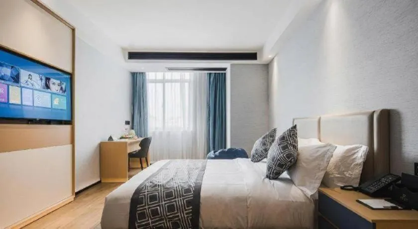 Bed in GEM Hotel Changzhou Xuejia'aoyuan North High-Speed Railway Station