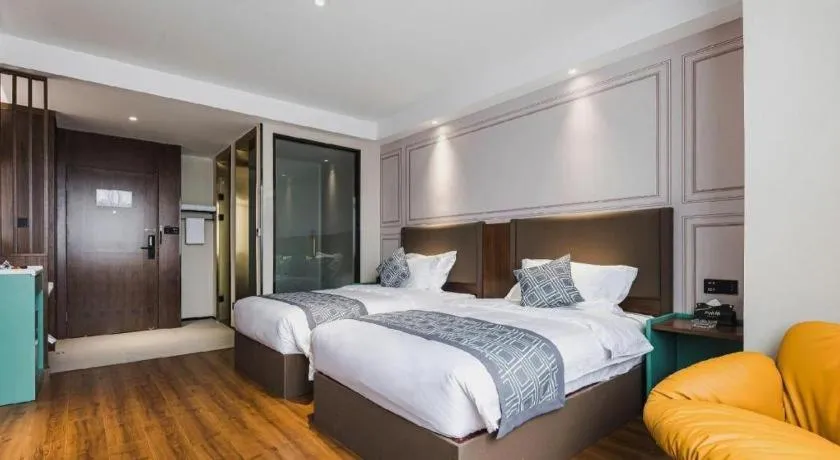 Bed in GEM Hotel Changzhou Xuejia'aoyuan North High-Speed Railway Station