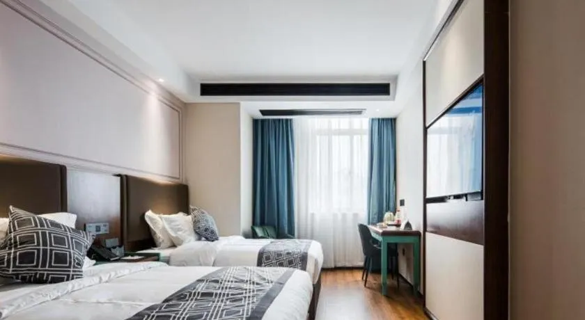 Bed in GEM Hotel Changzhou Xuejia'aoyuan North High-Speed Railway Station