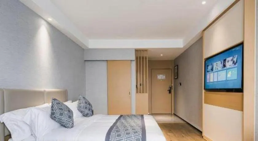 Bed in GEM Hotel Changzhou Xuejia'aoyuan North High-Speed Railway Station