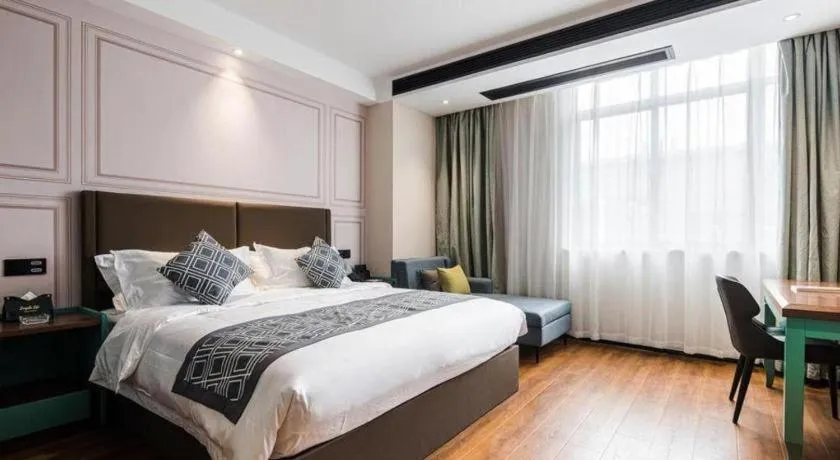 Bed in GEM Hotel Changzhou Xuejia'aoyuan North High-Speed Railway Station