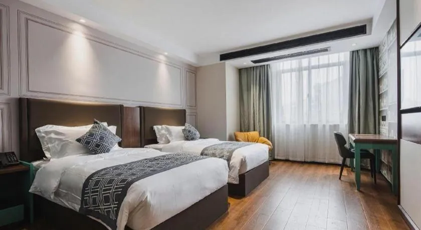 Bed in GEM Hotel Changzhou Xuejia'aoyuan North High-Speed Railway Station