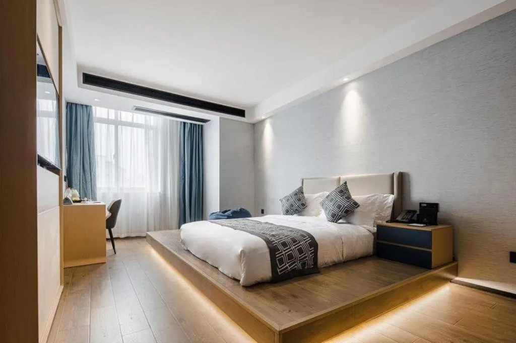 Bed in GEM Hotel Changzhou Xuejia'aoyuan North High-Speed Railway Station