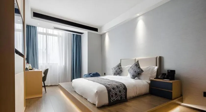 Bed in GEM Hotel Changzhou Xuejia'aoyuan North High-Speed Railway Station