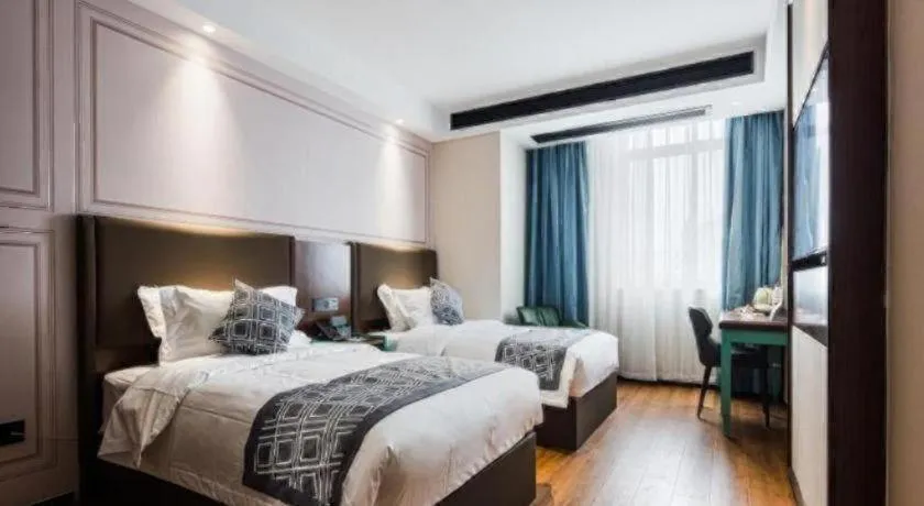 Bed in GEM Hotel Changzhou Xuejia'aoyuan North High-Speed Railway Station