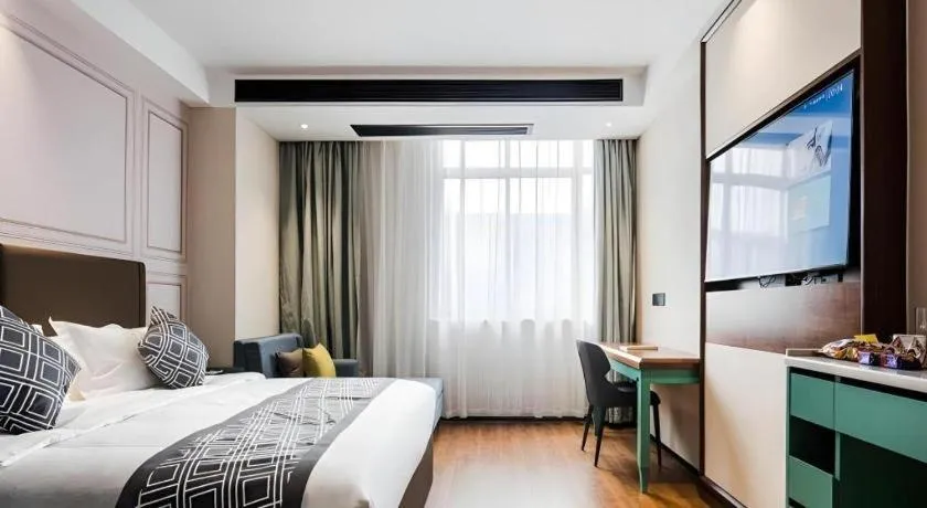 Bed in GEM Hotel Changzhou Xuejia'aoyuan North High-Speed Railway Station