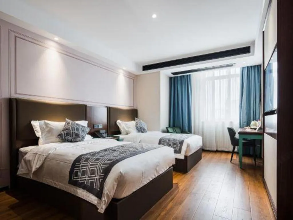 Bed in GEM Hotel Changzhou Xuejia'aoyuan North High-Speed Railway Station