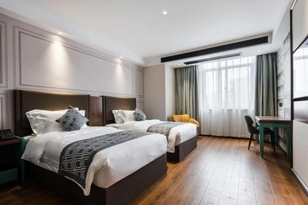 Bed in GEM Hotel Changzhou Xuejia'aoyuan North High-Speed Railway Station