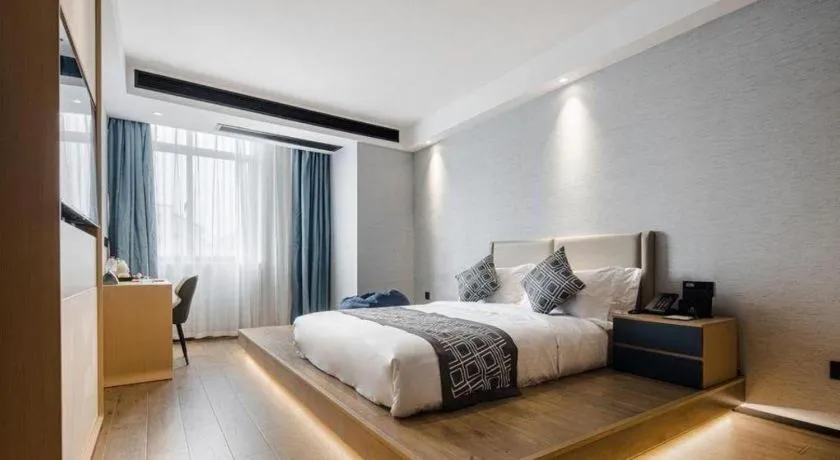 Bed in GEM Hotel Changzhou Xuejia'aoyuan North High-Speed Railway Station