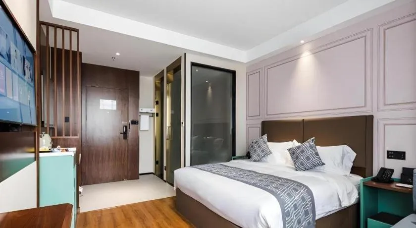 Bed in GEM Hotel Changzhou Xuejia'aoyuan North High-Speed Railway Station