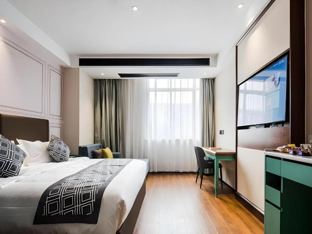 Bed in GEM Hotel Changzhou Xuejia'aoyuan North High-Speed Railway Station