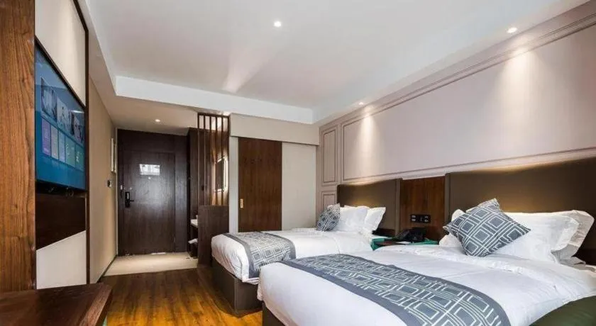 Bed in GEM Hotel Changzhou Xuejia'aoyuan North High-Speed Railway Station