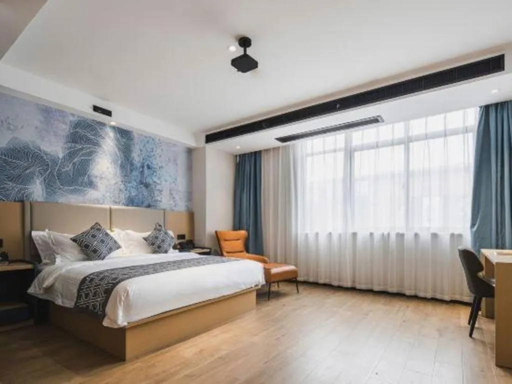 Bed in GEM Hotel Changzhou Xuejia'aoyuan North High-Speed Railway Station