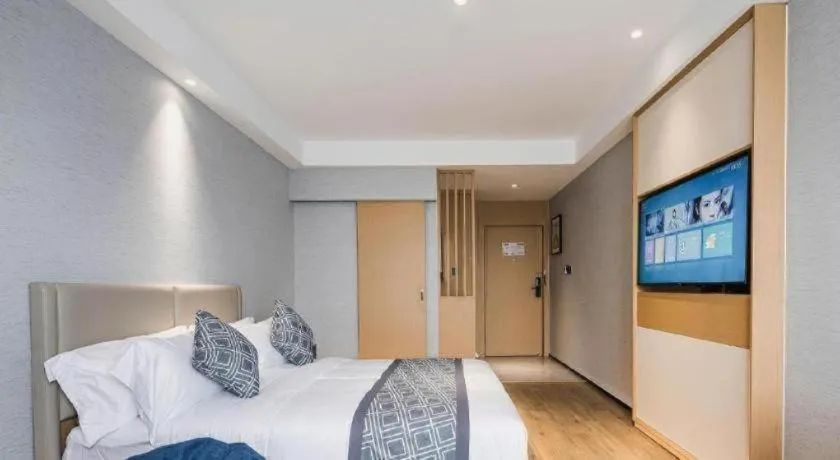 Bed in GEM Hotel Changzhou Xuejia'aoyuan North High-Speed Railway Station