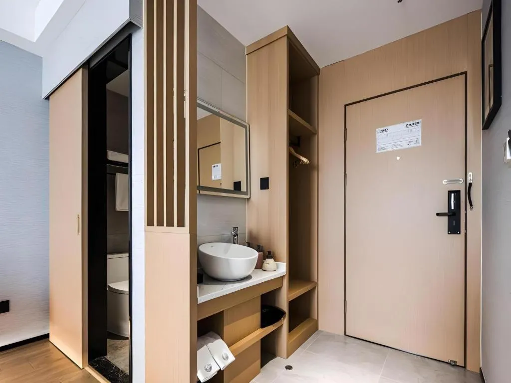 Bed in GEM Hotel Changzhou Xuejia'aoyuan North High-Speed Railway Station