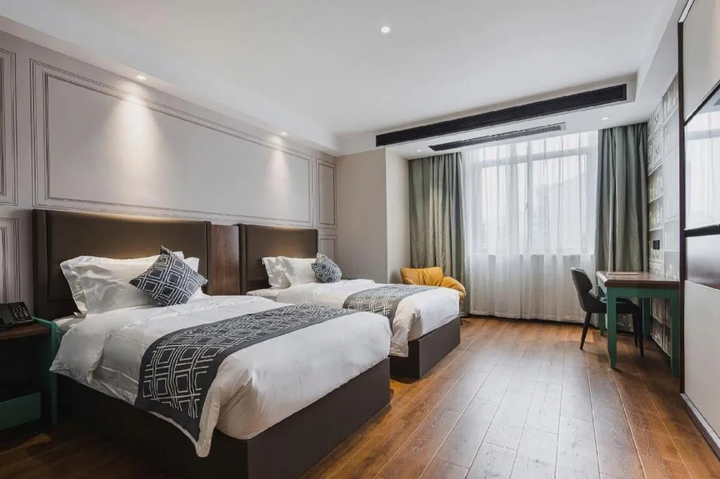 Bed in GEM Hotel Changzhou Xuejia'aoyuan North High-Speed Railway Station