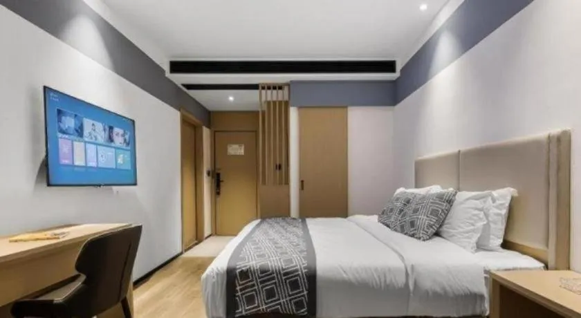 Bed in GEM Hotel Changzhou Xuejia'aoyuan North High-Speed Railway Station