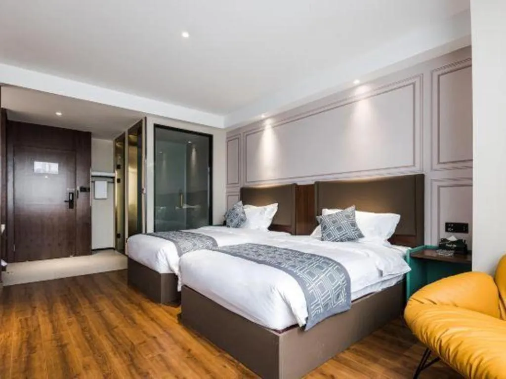 Bed in GEM Hotel Changzhou Xuejia'aoyuan North High-Speed Railway Station