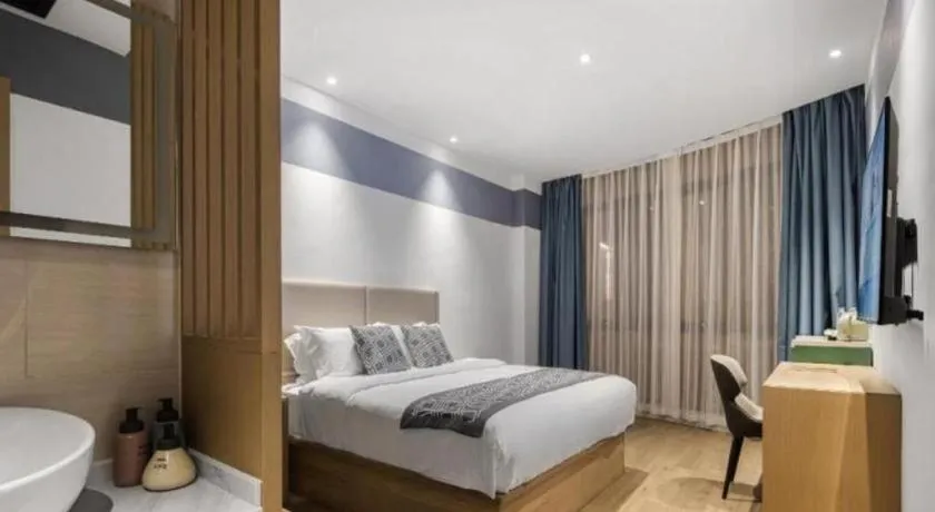 Bed in GEM Hotel Changzhou Xuejia'aoyuan North High-Speed Railway Station