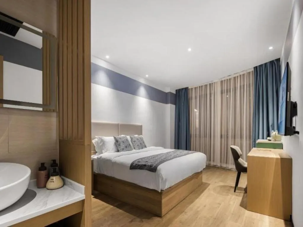 Bed in GEM Hotel Changzhou Xuejia'aoyuan North High-Speed Railway Station