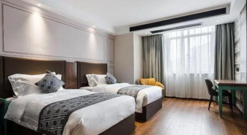 Bed in GEM Hotel Changzhou Xuejia'aoyuan North High-Speed Railway Station