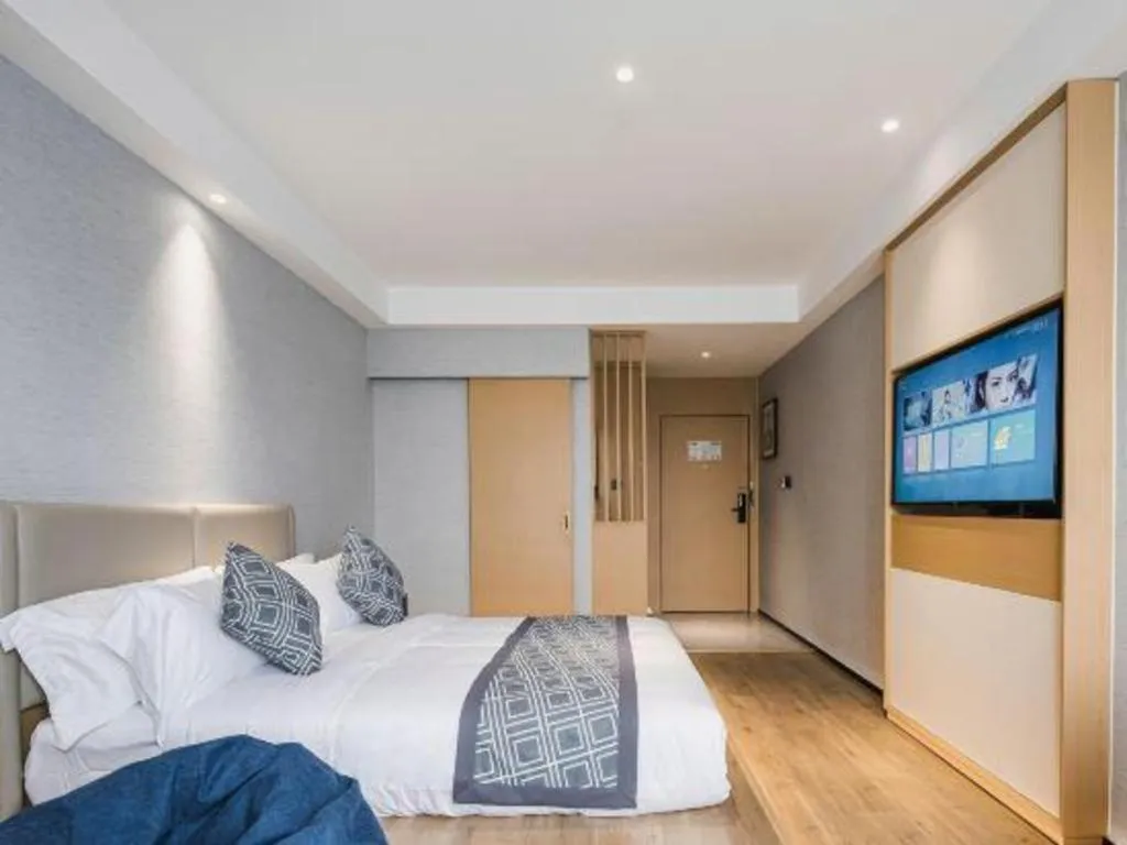 Bed in GEM Hotel Changzhou Xuejia'aoyuan North High-Speed Railway Station