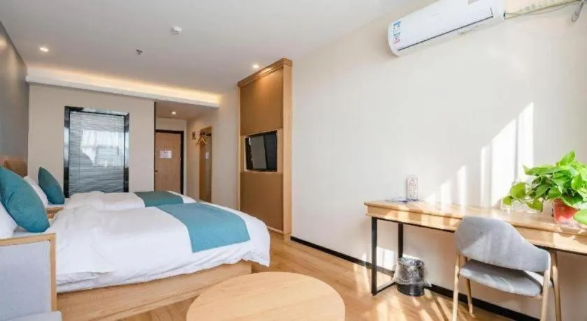 Bed in Shell Hotel Bozhou Lixin County Passenger Center