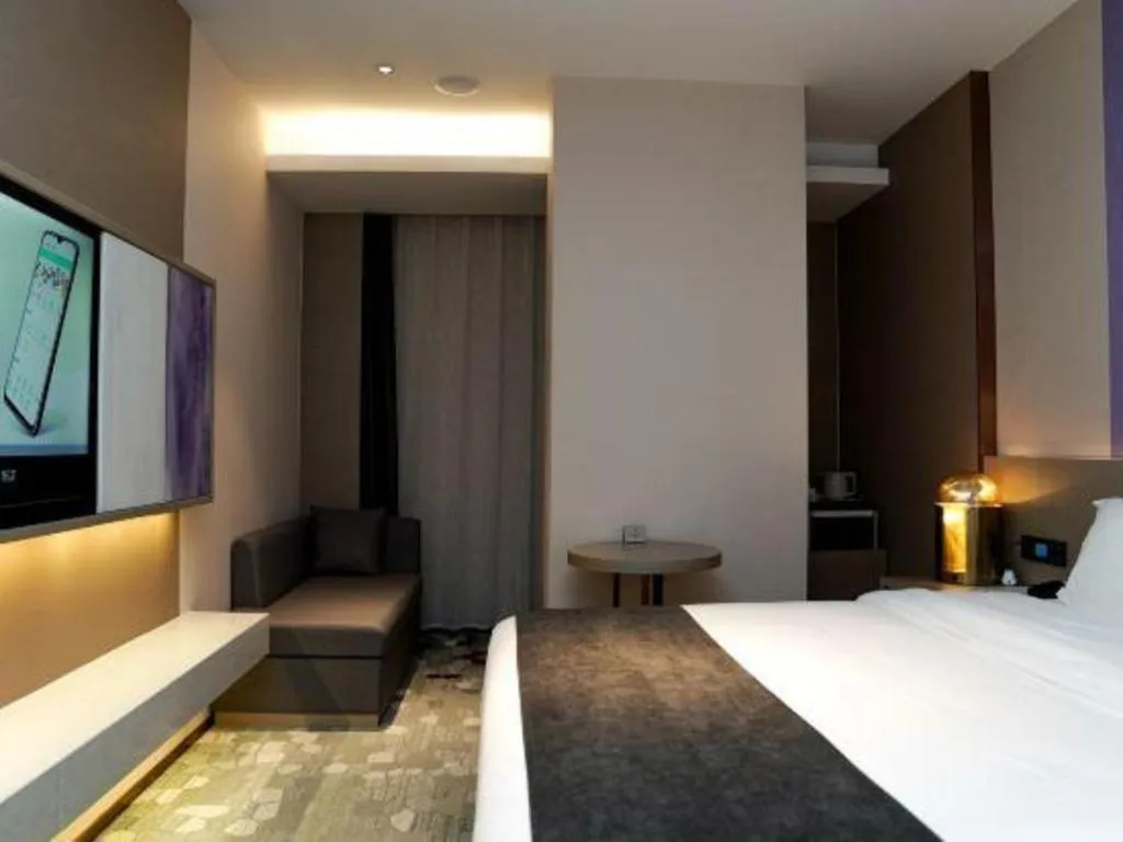 Bed in Lavande Hotel Shanghai Jing'an Shibei Gaoxin