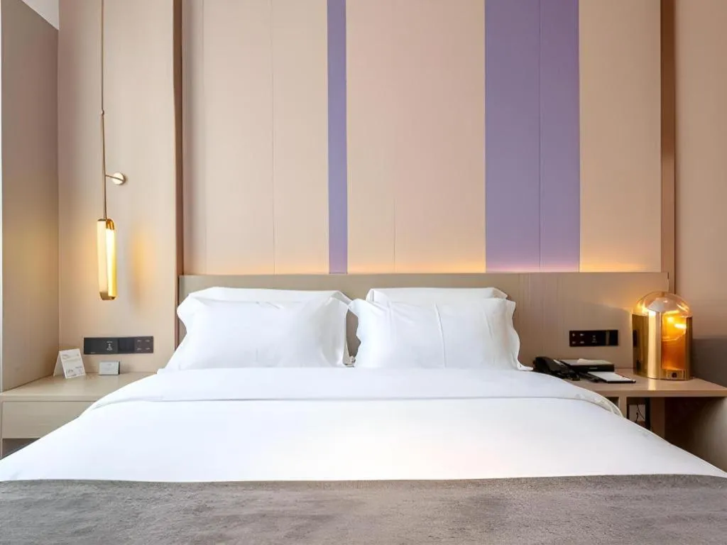 Bed in Lavande Hotel Zhongshan Shiqi Daxinxinduhui North Zhongshan Station
