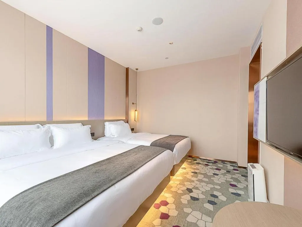 Bed in Lavande Hotel Zhongshan Shiqi Daxinxinduhui North Zhongshan Station