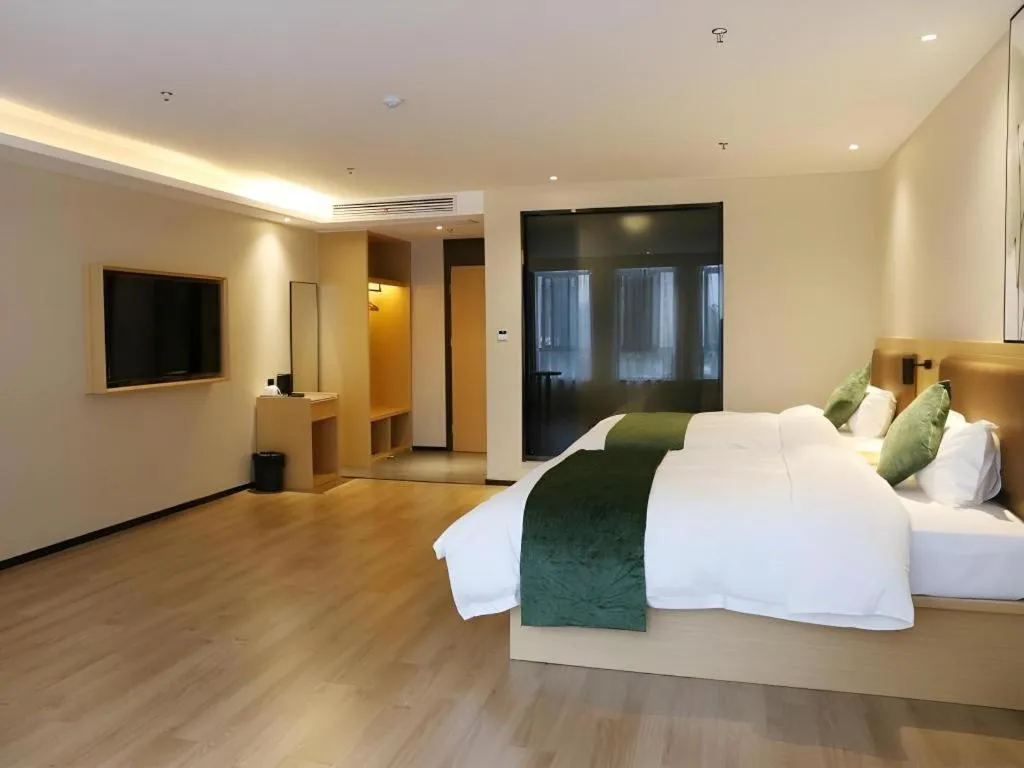 Bed in Green Tree Inn Express Chizhou Gymnasium