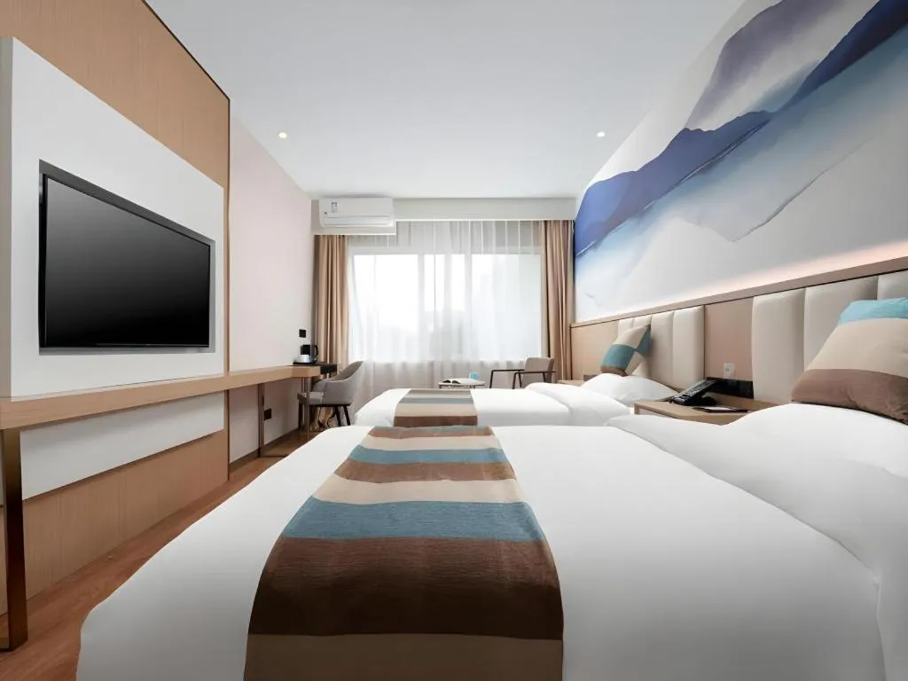 Bed in VX Hotel Beijing Daxing Wufutang Metro Station Zhongke Dianshanggu