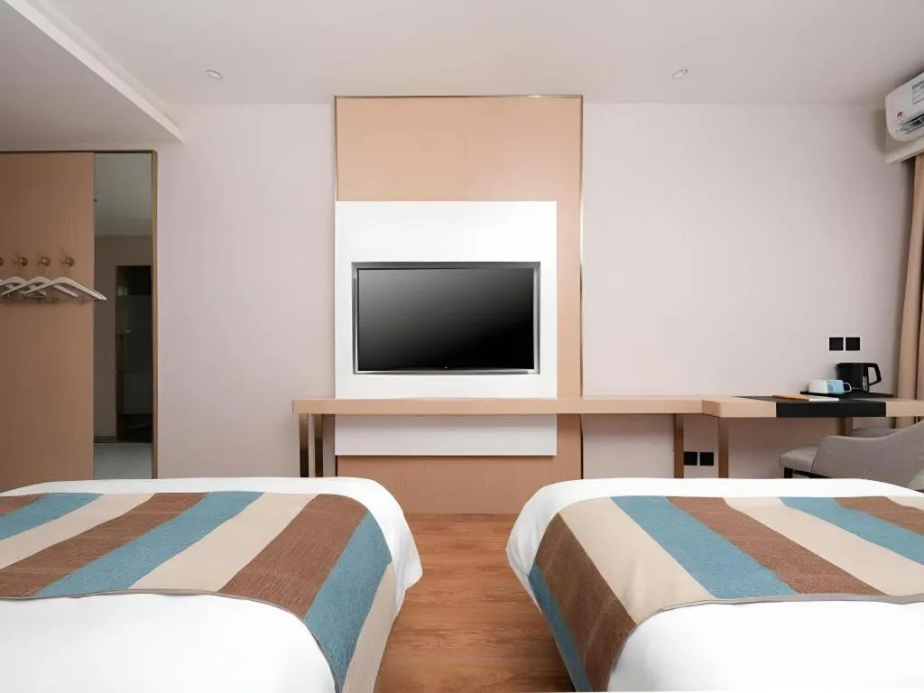 Bed in VX Hotel Beijing Daxing Wufutang Metro Station Zhongke Dianshanggu