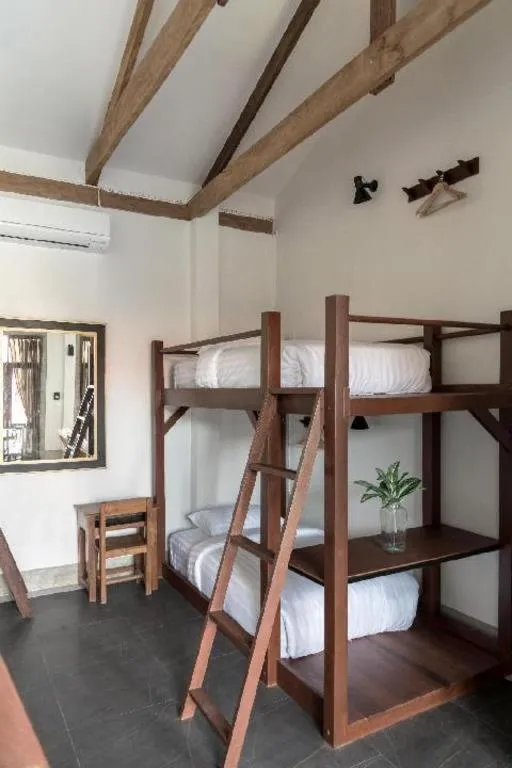 Bed in Uthai Heritage Hotel