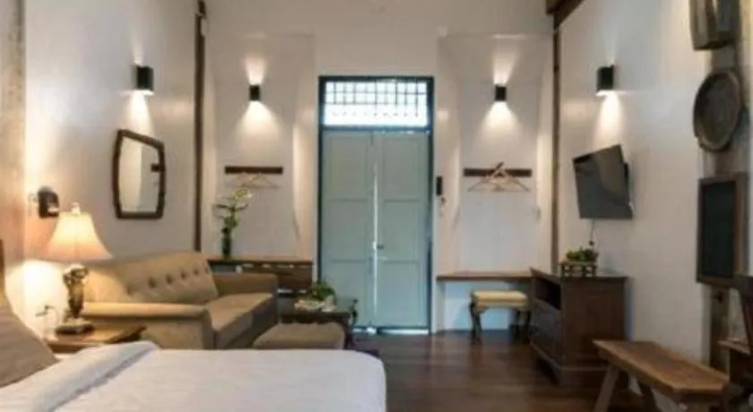 Bed in Uthai Heritage Hotel