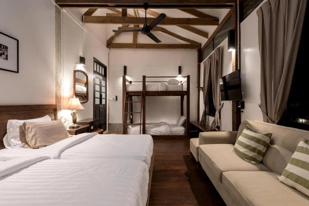 Bed in Uthai Heritage Hotel