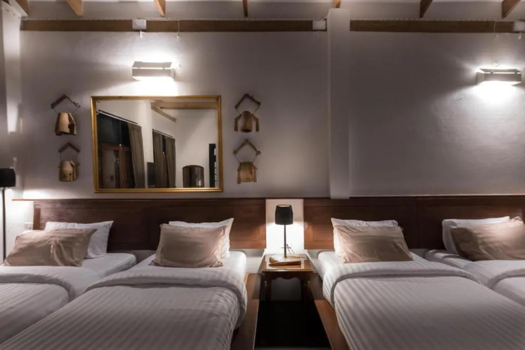 Bed in Uthai Heritage Hotel