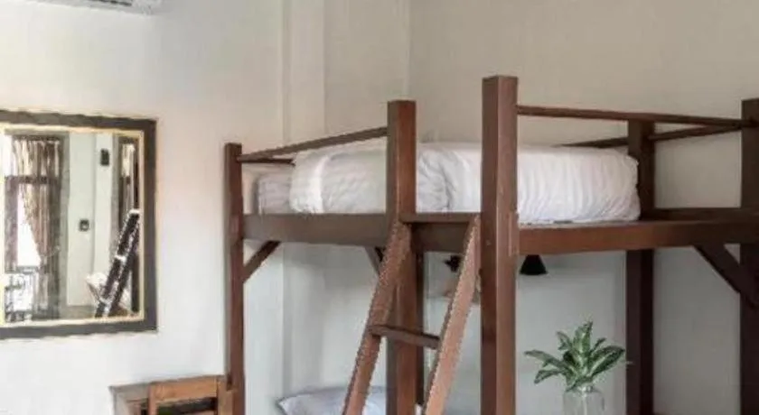 Bed in Uthai Heritage Hotel